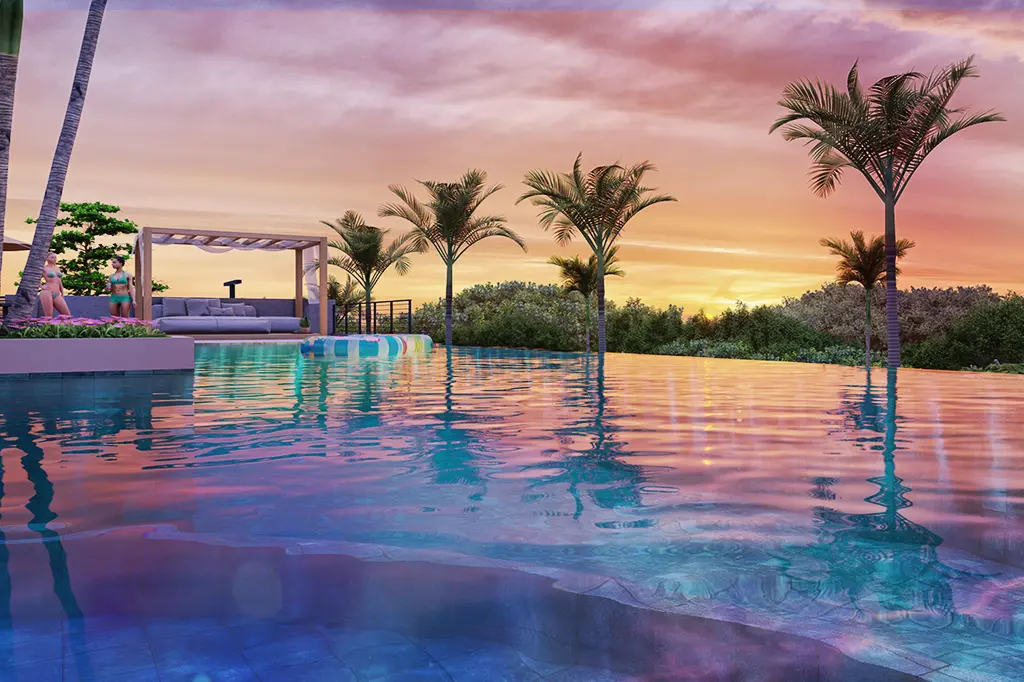 Piscina infinita com água cristalina refletindo as cores do pôr do sol, rodeada por palmeiras e vegetação tropical, com espreguiçadeiras e pessoas ao fundo em um ambiente de lazer sofisticado.