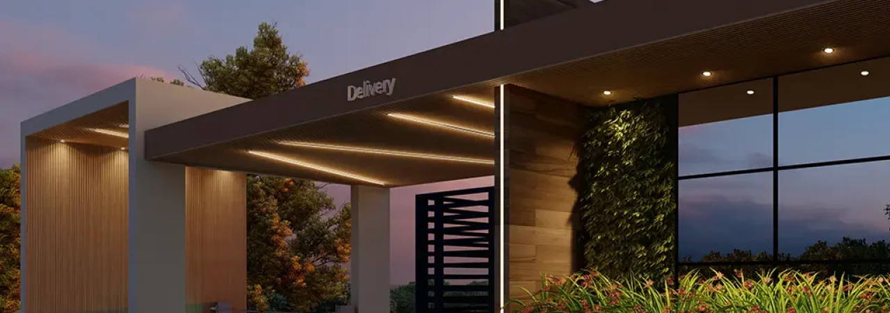 Entrada moderna de um espaço de delivery em um condomínio, com design sofisticado, iluminação embutida, paredes de vidro e área verde integrada, ao entardecer.