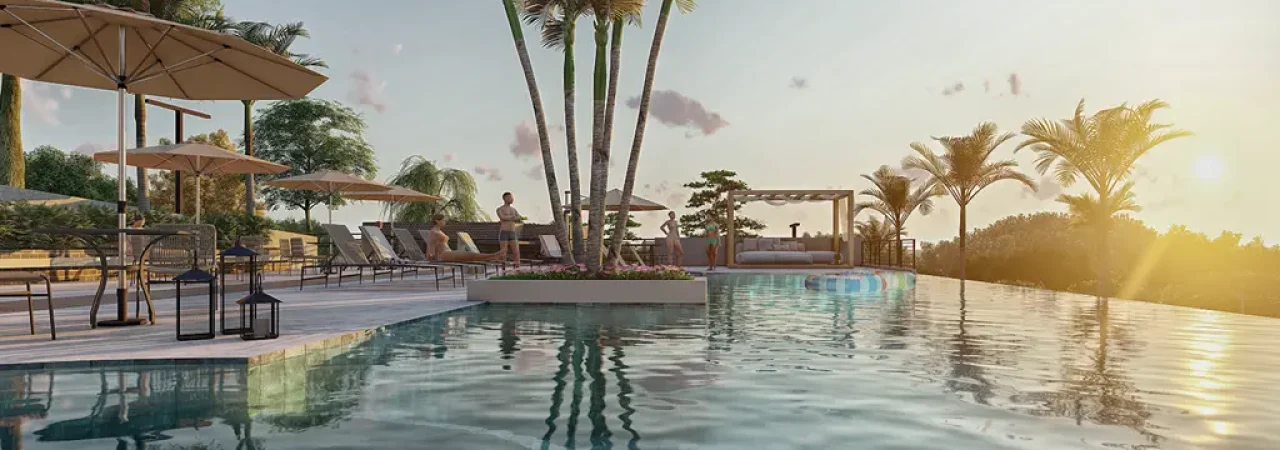 Piscina infinita em um resort de luxo ao pôr do sol, cercada por palmeiras, espreguiçadeiras e guarda-sóis, proporcionando um ambiente sofisticado e relaxante.